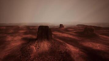 Mysterious red landscape with rock formations under a cloudy sky video
