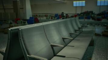 Abandoned airport terminal with empty seating and scattered debris video
