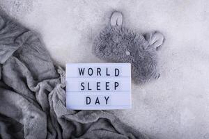World sleep day concept with alarm clock photo