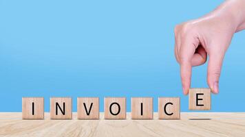 Invoice and online digital statements concept, Financial report and bank management with online payment concept on wooden block. photo