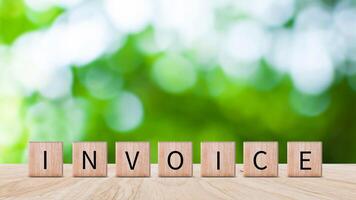 Invoice and online digital statements concept, Financial report and bank management with online payment concept on wooden block. photo