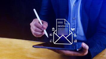 Invoice and online digital statements concept, using touch with invoice icons on virtual screen, Financial report and bank management with online payment concept E.invoice invoice. photo