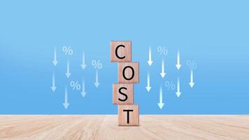Cost reduction concept on wooden cube, Expenses and saving money, Business strategy and project management, cost reduction, efficient business and budget cutting. photo