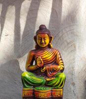 Statue of Buddha on abstract background photo