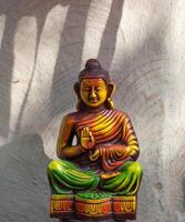 Statue of Buddha on abstract background photo