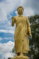 Statue of Buddha in sky background. Giant Buddha Statue. photo