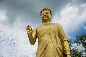 Statue of Buddha in sky background. Giant Buddha Statue. photo