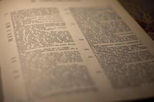 macro photography of a book page with text in Latin font photo