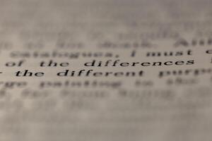 macro photography of a book page with text in English font photo