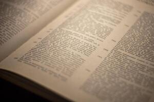 macro photography of a book page with text in Latin font photo