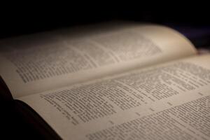 macro photography of a book page with text in Latin font photo