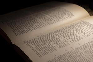 macro photography of a book page with text in Latin font photo