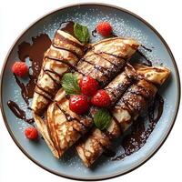 Chocolate crepe on plate top view isolated on white background with shadow. Chocolate pancake dessert on ceramic plate photo