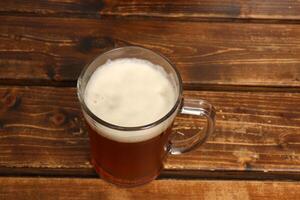Beer is a low-alcohol drink obtained by alcoholic fermentation of malt wort. photo