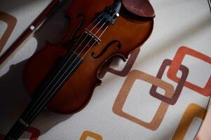 Top view of a violin on a patterned surface photo