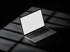 Laptop Mockup on Dark Surface for Elegant and Professional Technology Display photo