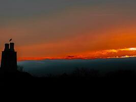 A sunset over a city photo