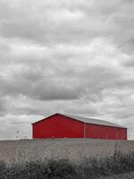 A red barn on a farm field photo