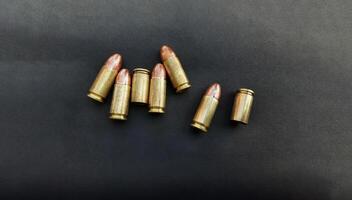 9mm pistol gun bullets and cartridge cases. Flat lay. Space for text. Concept, dangerous weapon for shooting. photo