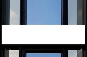 Mock up white horizontal billboard on entrance building. Clipping path for mockup photo