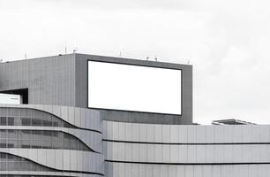Mock up white LED display billboard on shopping mall building. Clipping path for mockup photo