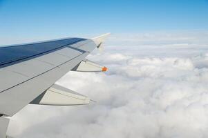 Above clouds in a plane photo