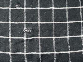 black rag with white lines isolated on white background. photo