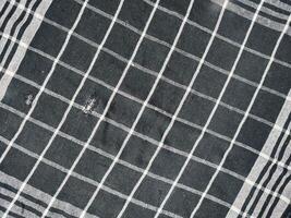 black rag with white lines isolated on white background. photo