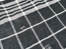 black rag with white lines isolated on white background. photo