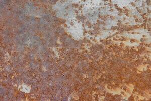 Red rusted metal, grunge distressed metallic surface texture background. photo