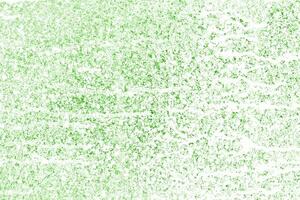 Splashes and drops of white paint on green wall surface background photo