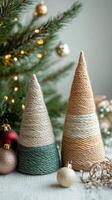 Rustic Christmas decorations with yarn-wrapped trees and ornaments. Christmas handmade decor and craftwork, eco friendly, sustainable concept. photo