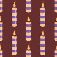 Seamless pattern with striped candles and glowing flames vector