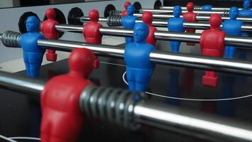 Football table or soccer table game with plastic player figurine. Mini Soccer game which famous in past and be collectable item for foosball lover. Play by two hand control each row of player figurine photo