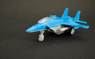 Model plane isolated on the dark background photo