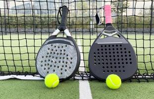 Paddle tennis objects on grass court photo