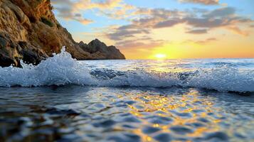 A sunset over the ocean with waves crashing into the shore photo