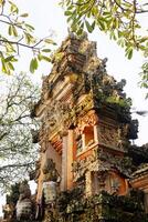 Ancient Pagoda of Portal von Taman Saraswati temple in Ubud city landmark on Bali Island of Indonesia. Travel destination for culture of Asian photo