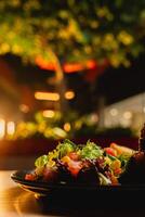 Lunch featuring a steak filet, salad, and French fries, elegantly presented on a table. photo