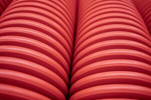 abstract background with striped tube corrugated orange red white. High quality photo