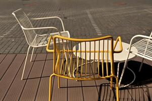 two yellow chairs sit on a wooden floor photo