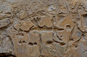 a large rock wall with many different shapes and designs photo