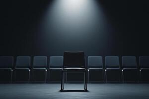 Chair in the spotlight with empty chairs in the background photo