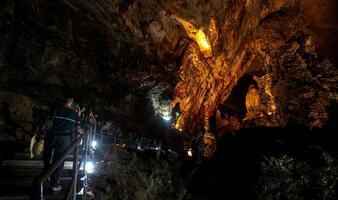 Exploring the stunning caves of Parque Nacional Grutas de Cacahuamilpa at dusk photo