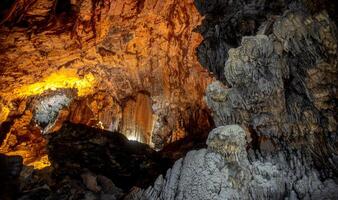 Exploring the stunning formations of Grutas de Cacahuamilpa National Park at sunset photo