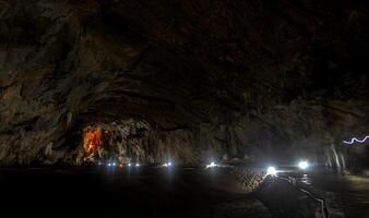 Stunning rock formations illuminated in Cacahuamilpa Caves during an evening exploration photo