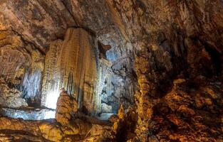 Stunning limestone formations illuminated inside Cacahuamilpa Caves National Park photo