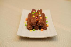 Chocolate wafers on a white plate, close-up photo