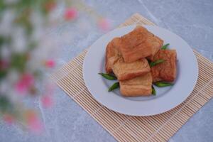 Tahu Bakso, Indonesian traditional snack made from tofu and beef. Served in white plate. photo