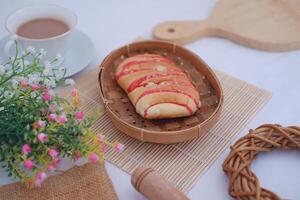 Strawberry bread with chocolate drink on white backgroundStrawberry bread with chocolate drink on white background photo